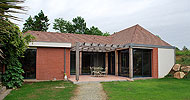 Extension d’une maison individuelle à LA HAYE PESNEL. Arnaud PAQUIN, architecte.